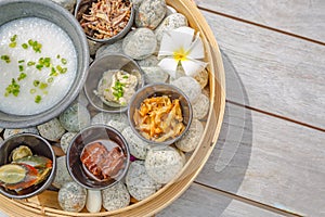 Assorted dim sum appetizers on rustic background. Set of Chinese food for share. Asian buffet. Traditional Chinese dim sum food