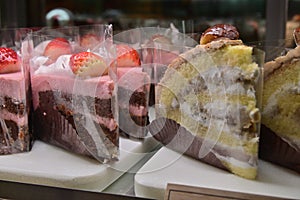 Assorted display cake in window