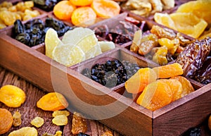 Assorted dried fruits in wooden box