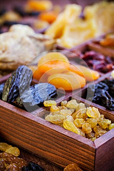 Assorted dried fruits in wooden box