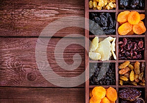 Assorted dried fruits in wooden box