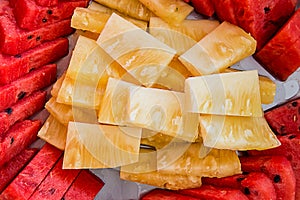 Assorted exotic fresh fruits. slide and peice of fresh fruit on white plate. photo