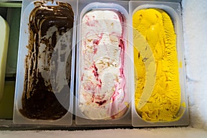 Assorted flavor ice cream in display freezer