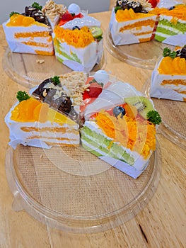 Assorted flavored cakes being arranged in a box