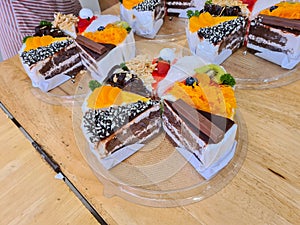 Assorted flavored cakes being arranged in a box