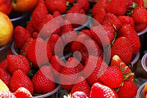 assorted fresh berries (berry) fruits in a street stall for sell