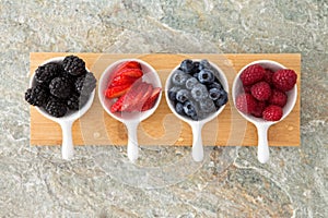 Assorted fresh berries in taster dishes