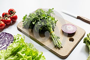 Assorted fresh vegetables and wooden cutting