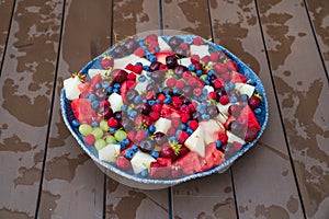 assorted fruits and berries on a plate. summer harvest.