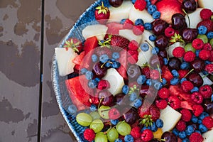 assorted fruits and berries on a plate. summer harvest.