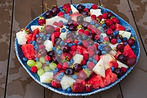 assorted fruits and berries on a plate. summer harvest.