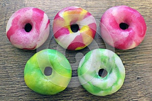 Assorted glazed donuts on a background