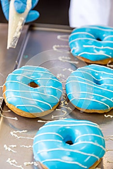 Assorted glazed doughnuts in different colors