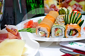 Assorted gourmet sushi rolls on a buffet