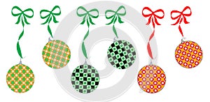 Assorted green, gold and red Christmas ornaments hang from ribbons and bows