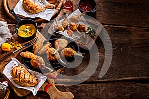 Assorted grilled chicken portions on a buffet photo