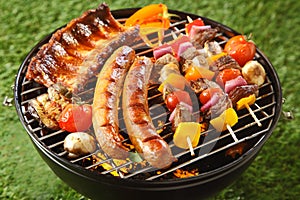 Assorted grilled meat on a summer barbecue