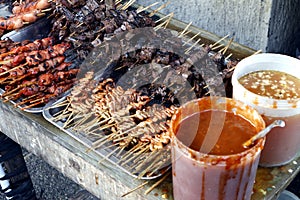 Assorted grilled pork innards such as intestine, liver, gizzard and blood in barbecue sticks