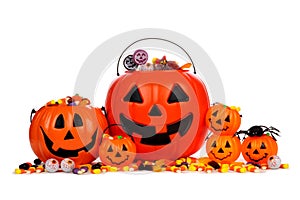 Assorted Halloween Jack o Lantern candy pails isolated on white