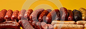 Assorted handcrafted sausages, rich in detail, fading into a smooth mustard-yellow gradient