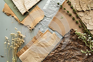 Assorted handmade paper and dried plants