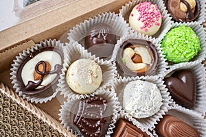 assorted handmade sweets, Swiss chocolates in gift box, various luxury pralines made of dark and milk organic chocolate