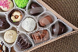 assorted handmade sweets, Swiss chocolates in gift box, various luxury pralines made of dark and milk organic chocolate