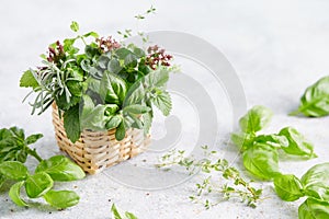 Assorted herbs in small wicker basket