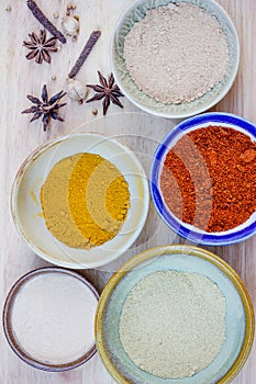Assorted hot spicy powders in ceramic bowls