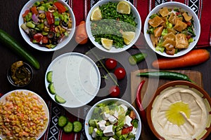 Assorted hummus, raita, Fattoush, Mutabal, Quinoa Salad, snack served in dish isolated on table top view of arabic food