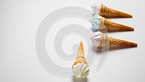 Assorted ice cream in sugar cones isolated on white background