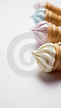 Assorted ice cream in sugar cones isolated on white background