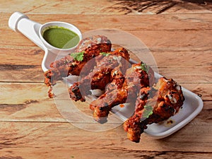 Assorted indian food Chicken makrana kebab on wooden background. Dishes and appetizers of indian cuisine, selective focus