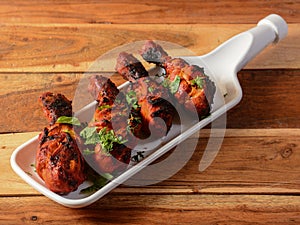 Assorted indian food Chicken makrana kebab on wooden background. Dishes and appetizers of indian cuisine, selective focus