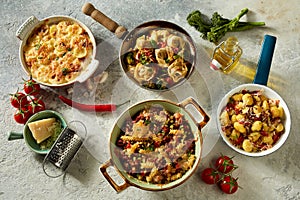 Assorted Italian dishes served on concrete table