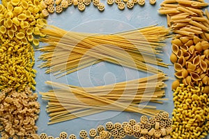 Assorted Italian pasta: Penne rigate, Rotelle, Conchiglie, Cavatappu, Fusilli, Cellentani, Spaghetti, horizontal