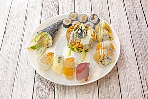 Assorted Japanese sushi with bluefin tuna nigiri, uramaki and avocado surimi, Norwegian salmon tartare and caviar, California roll