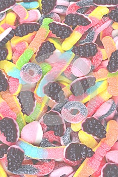 Assorted juicy colorful gummy candies. Top view. Candy background