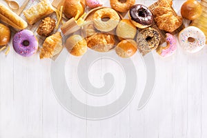 Assorted junk food multiple type on white wooden table of top view with copy space