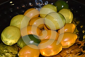 Assorted lemons in bowl photo