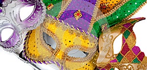 Assorted mardi gra masks on white