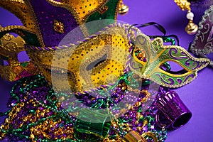 Assorted Mardi Gras or Carnivale mask on a purple background