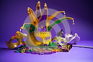 Assorted Mardi Gras or Carnivale mask on a purple background