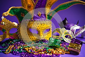 Assorted Mardi Gras or Carnivale mask on a purple background