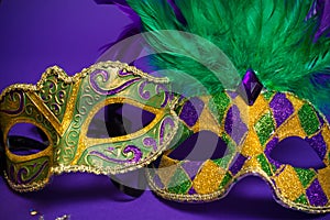 Assorted Mardi Gras or Carnivale masks on purple