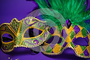 Assorted Mardi Gras or Carnivale masks on purple photo