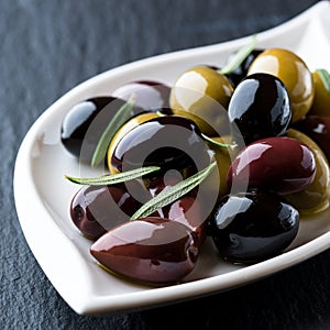 Assorted marinated olives on a plate