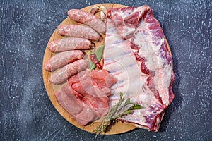 Assorted meat. Arrange the raw pork ribs, minced meat, sausages, and carbonate on a round cutting board. Seasonings for cooking
