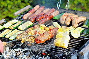 Assorted meat and vegetables on barbecue gril