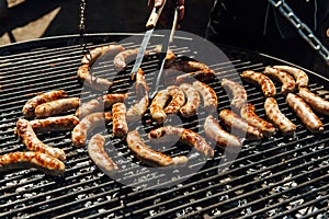 Assorted meat and vegetables grilling over fire